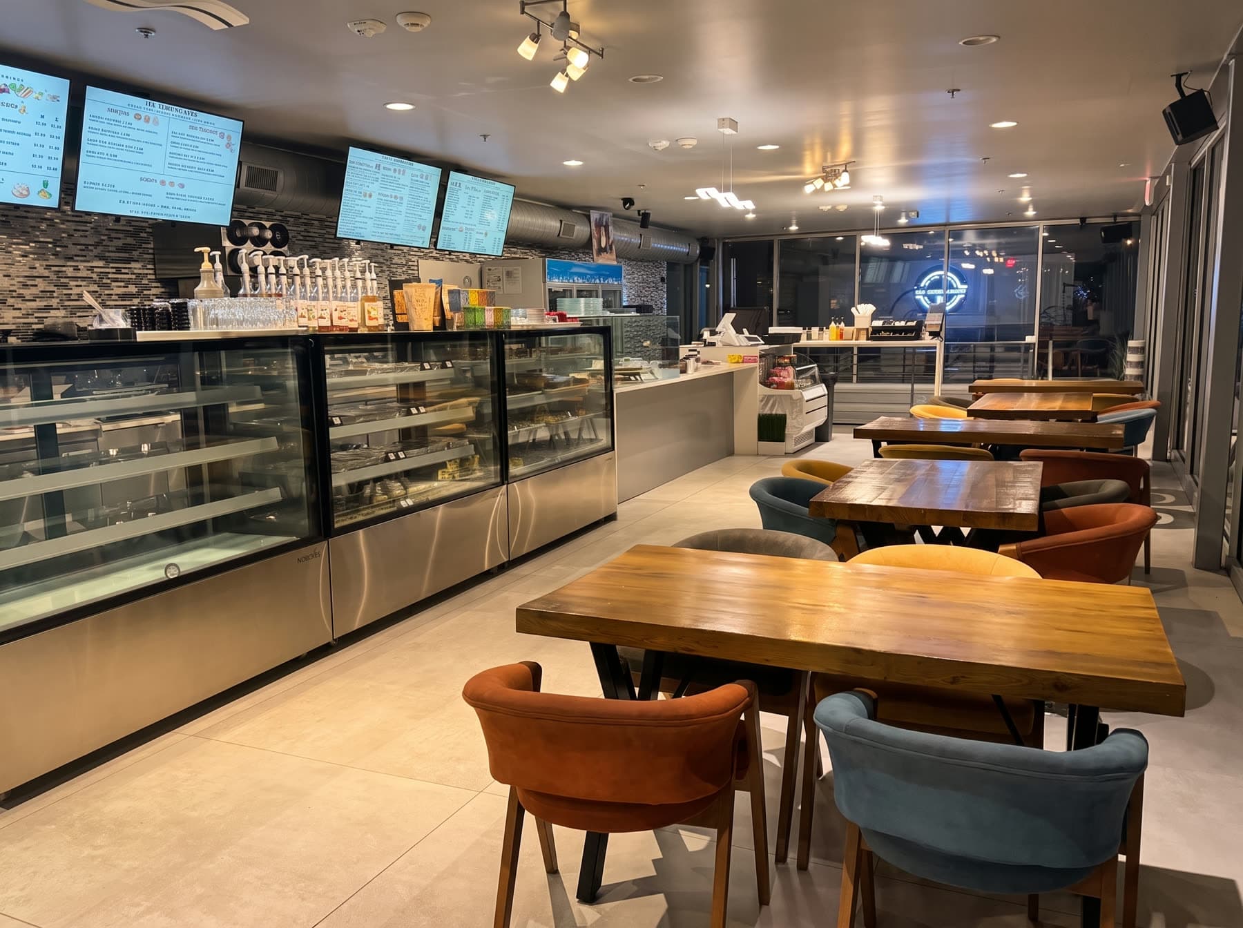 The Turkish Brew counter and pastry case, with seating along the front windows